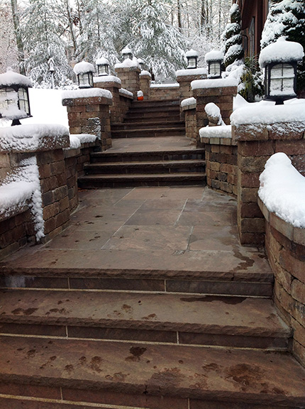 A radiant walkway and steps after a snowstorm.